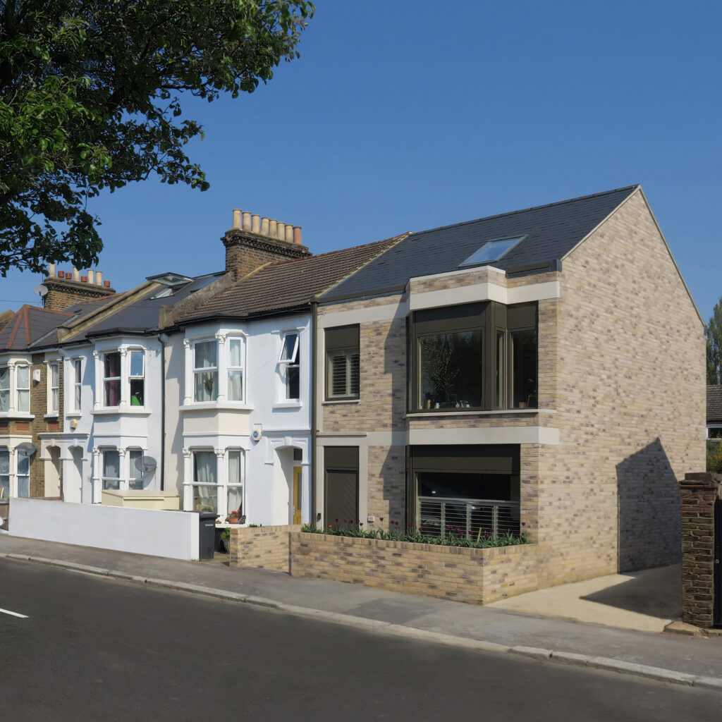 A contemporary house added on to the end of a victorian terrace.